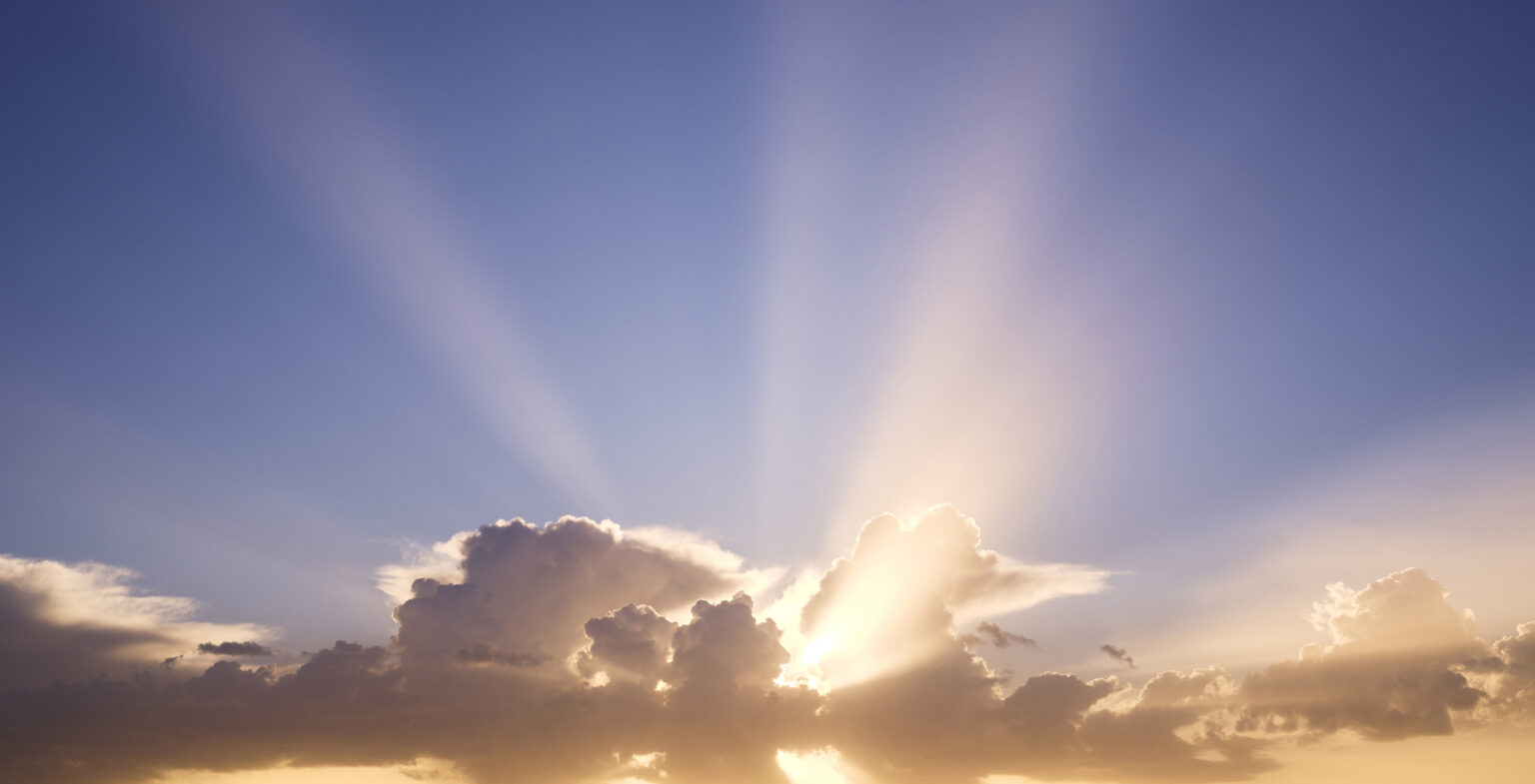 Spain, Canary Islands, Lanzarote, Timanfaya National Park, light breaking through storm clouds in the early morning